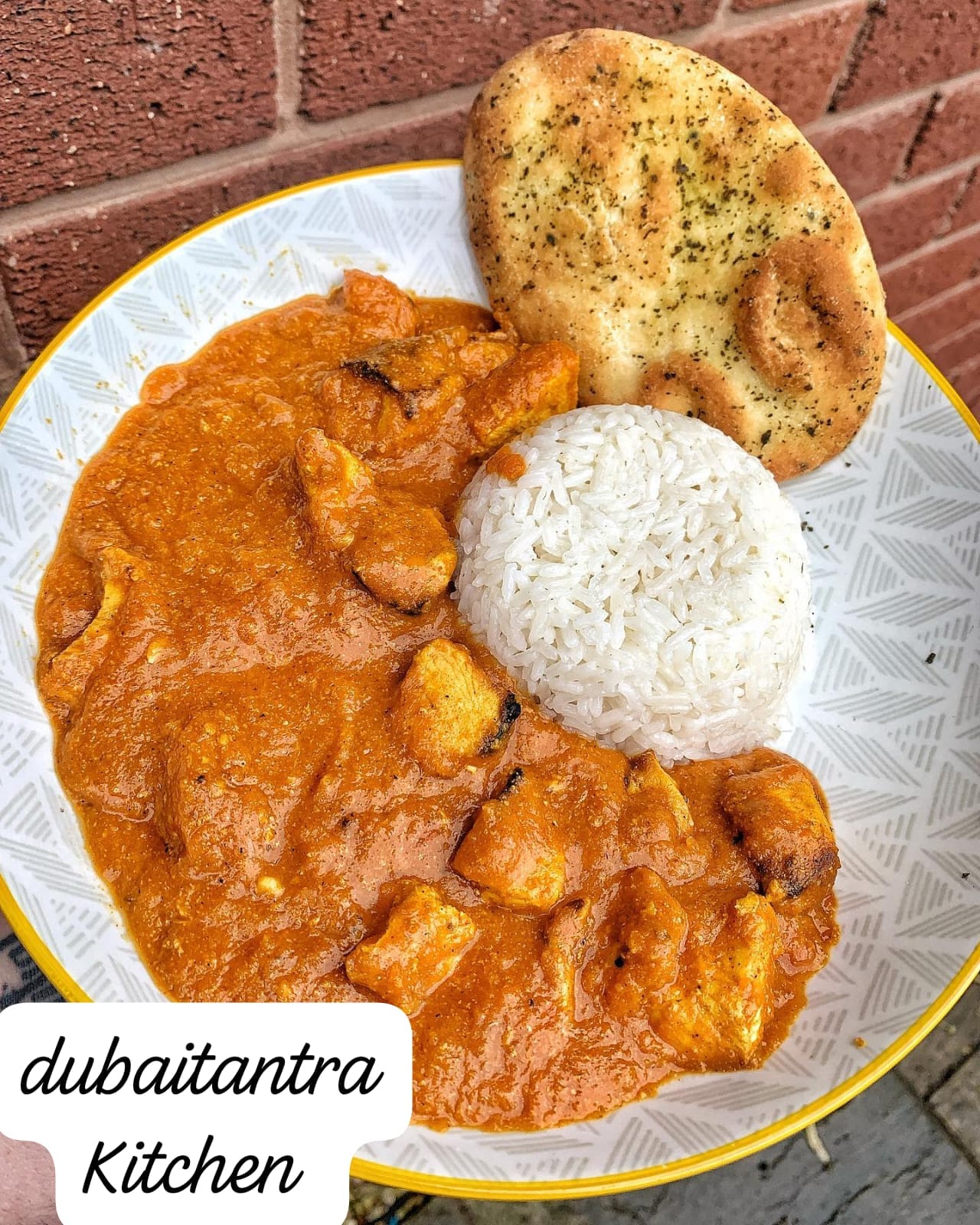 Chicken Tikka Masala served with basmati rice and garlic naan