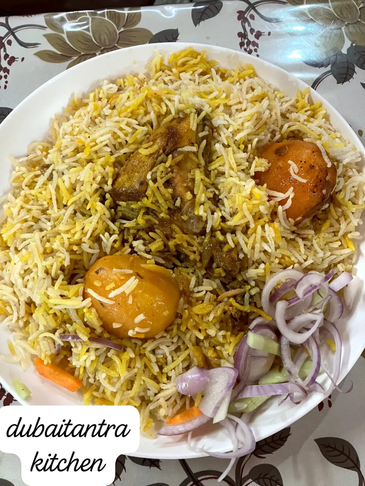 Kolkata-style chicken biryani with fragrant basmati rice, chicken, potatoes, and boiled eggs